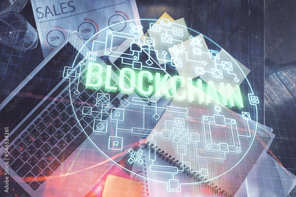 Poster Blockchain theme hologram drawings over computer on the desktop background. Top view. Double exposure.