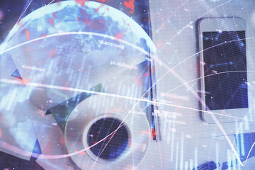 Multi exposure of forex graph hologram over desktop with phone. Top view. Mobile trade platform concept.