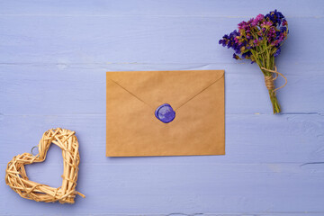 Letter envelope on lavender wooden background, copy space