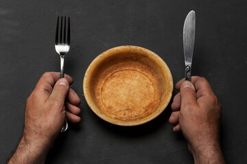 Empty bowl on dark background with copy space