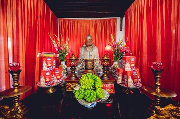 Buddhist idol Confucius inside a temple in Vietnam