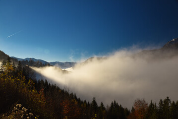 Salzachtal Pongau Salzburg gefüllt mit Nebel mit Fritztaler Berge im Hintergrund unter blau Himmel im Herbst,  Salzach valley filled with fog mountain and blue sky in fall in background