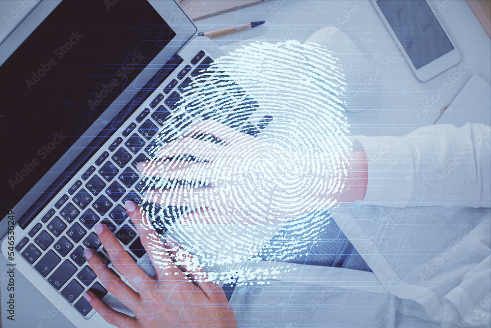 Poster Double exposure of woman hands working on computer and fingerprint hologram drawing. Top View. Digital Security concept.