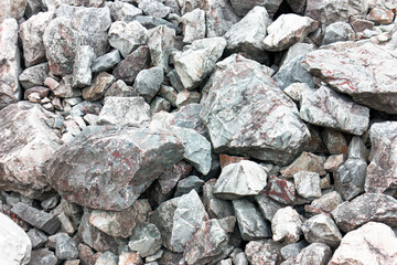 Crushed close up different granite stone texture background.