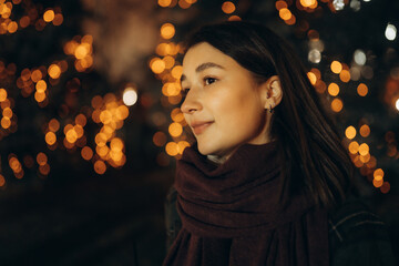 Happy woman at the Christmas market at night