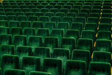 Fototapeta premium Rows of green empty seats in assembly hall
