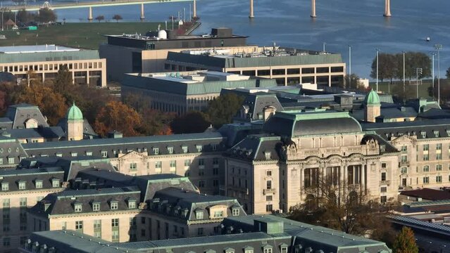 United States Naval Academy building. US Navy and Marine Corp training grounds and campus yard. Rising aerial with Annapolis Maryland in distance.