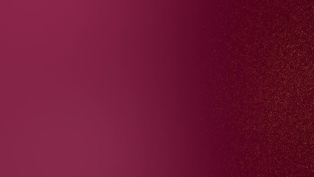 Gold tiny dots glitter on ruby red gradient background on the right side of the frame. Abstract backdrop party or holidays concept with copy space