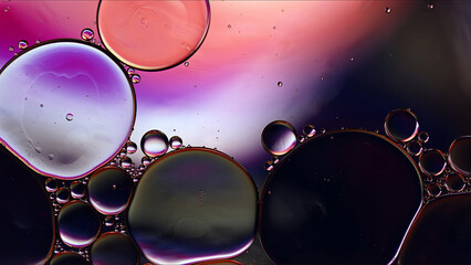Abstract Colorful Food Oil Drops Bubbles and spheres Flowing on Water Surface