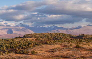 Evening light in the mountains, rocky ridge, clouds