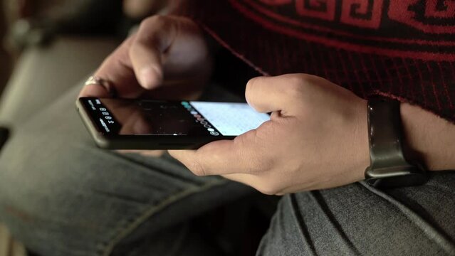 Person watching a video on his smartphone