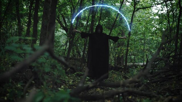 The witch in the forest conjures. A powerful magician, opens a portal to other worlds.