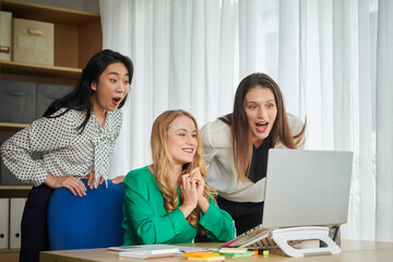 Amazed Businesswomen Reading Report