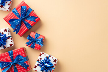 Forth of July concept. Top view photo of present boxes in national flag colors with ribbon bows on...