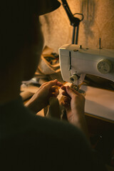 The girl sews on a sewing machine, High quality
