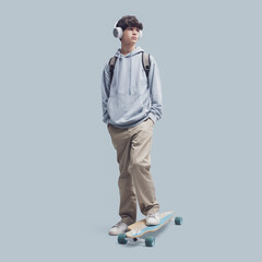 Teenager posing with a skateboard