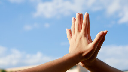 Team work together showing team strength, hands of multiracial people gathered volunteers Teamwork concept for business team success together.