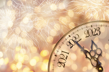 clock face on a Christmas background. the year 2023 is coming soon. the concept of the new year.