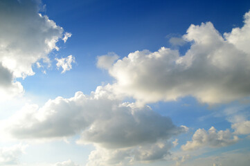 white fluffy clouds in the blue sky