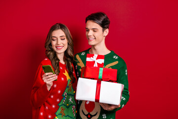 Photo of two funny cheerful people use telephone hold pile stack box package giftbox isolated on red color background