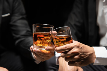 Businessmen in suits drinking  Celebrate whiskey