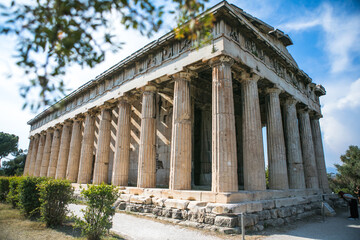 Temple of Hephaestus in Athens, Greece. Sunny view of Ancient Greek ruins in the Athens center. The Famous Hephaistos temple on the Agora in Athens, the capital of Greece.