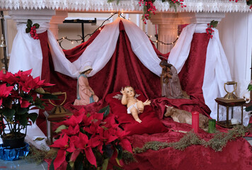 Nativity scene with baby Jesus. Elements of the Catholic Christian crib. Decor in the church. 