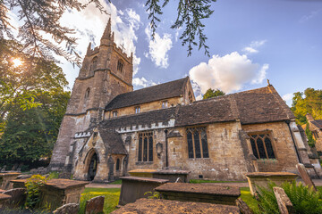 Castle Combe - May 28 2022: Old Cotswolds town of Castle Combe, England.