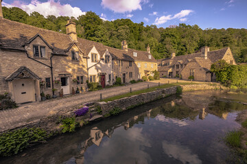 Fototapeta na wymiar Castle Combe - May 28 2022: Old Cotswolds town of Castle Combe, England.