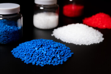 color red blue and white plastic polymer petrochemical product as polymer raw material for plastic in polymer chemical industry business design and test by engineer in polymer science laboratory