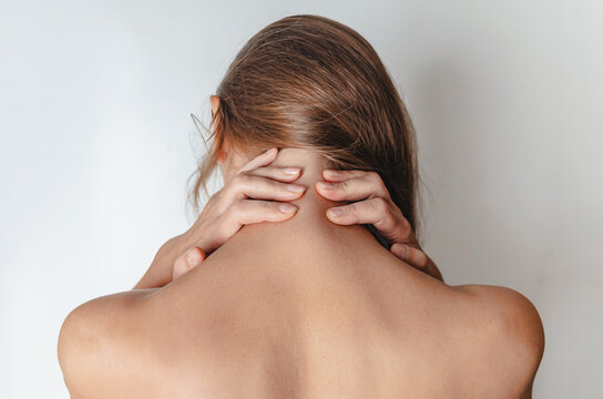 Close Up Woman With Bare Shoulders, Hands Behind Her Head. Rear View. SPA Treatment.