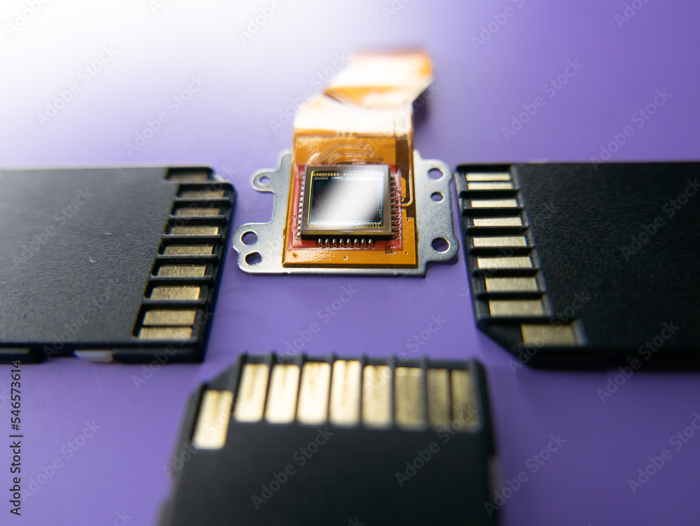 Poster camera matrix with memory cards on a purple background close-up
