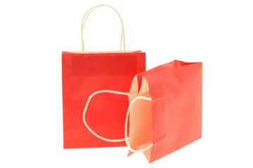 Two red empty paper shopping bags  isolated on transparency photo png file 