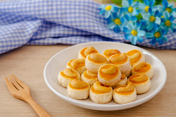 Cashew nut cookies or Singapore cookies on white plate .