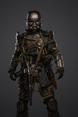 Fototapeta na wymiar Portrait of military survivor in post apocalypse dressed in armored costume.