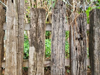 The fence is made of old wood that has passed the time giving it a classic look.