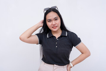 A young asian woman uncertain of what to do. Isolated on a white background.