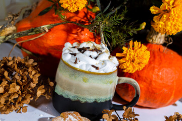 tea coffee with milk foam autumn scenery flowers pumpkins croissants