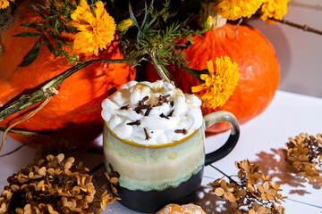 tea coffee with milk foam autumn scenery flowers pumpkins croissants