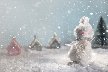 a snowman on a sled in the snow. New Year's, Christmas winter background
