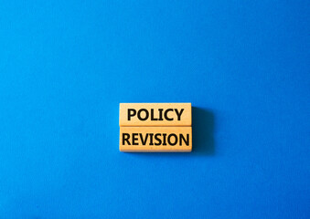 Policy revision symbol. Concept word Policy revision on wooden blocks. Beautiful blue background. Business and Policy revision concept. Copy space