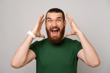 Wow this is amazing exclaims a handsome bearded man wearing green T shirt.