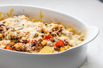 nachos with minced beef , red pepper and beans