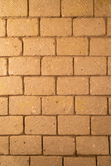 wall built of stone blocks of tuff