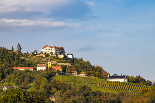 Kapfenstein castle and church with vineyard, Styria, Austria