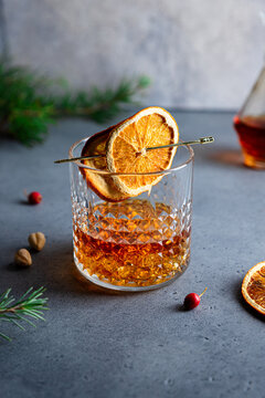 Glass of cognac with orange