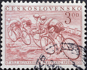 CZECHOSLOVAKIA - CIRCA 1952: a postage stamp from Czechoslovakia , showing a group of cyclists at a...