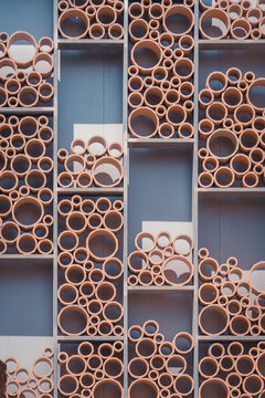 Decoration of plastic pipes in rectangle shaped shelves