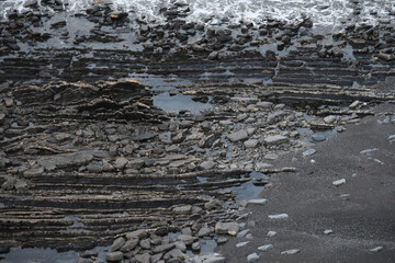 Inaccessible beach below the cliffs at Tresmorn the North Cornish Coast