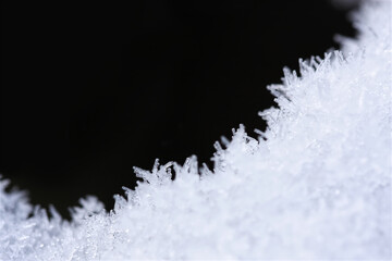 Crystals of ice make frame or border for abstract winter texture background